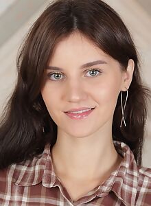 Cute shaved brunette takes off her jean shorts