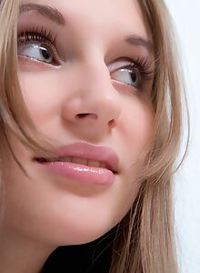 Lovely girl with long hair posing naked