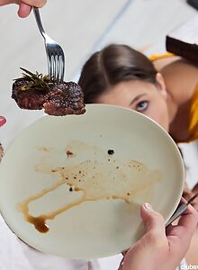 Horny brunette sucking a cock in the kitchen