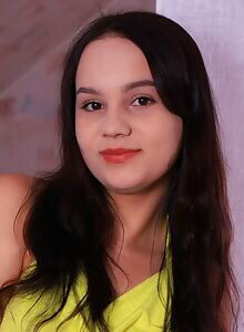 Cute shaved brunette takes off her dress