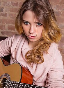 Cute blonde girl pulls her thong aside