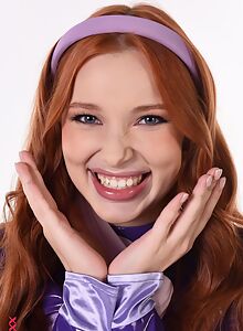 Redhead cosplayer toying her shaved pussy