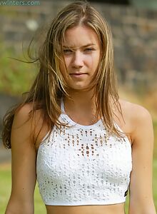 Cute amateur spreads her creamy hairy pussy in a field