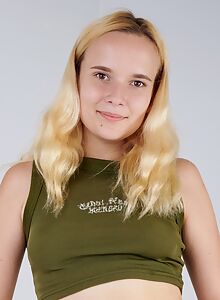 Tattooed blonde spreads her shaved pussy