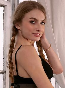 Athletic girl exposes her shaved pussy and pink asshole by a window