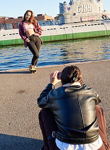 Shaved brunette licking and fingering each other in bed