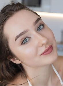 Gorgeous busty girl exposes her hairy bush in the kitchen