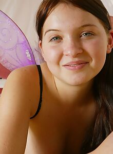 Insanely cute brunette tries on butterfly wings