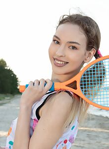 Cute girl spreads her ass at the beach