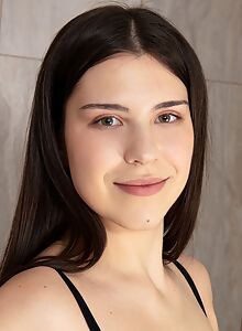 Tattooed brunette spreads her ass and pussy