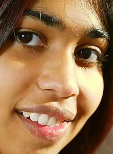 Cute exotic girl shows off her hairy bush