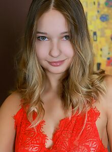 Cute blonde shows off her tan lines on the couch
