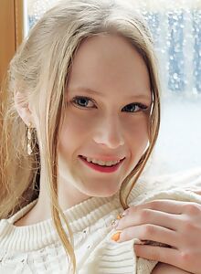 Cute freckled blonde with fair skin spreads her ass by a window
