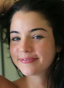 Cute amateur with black hair spreading in bed