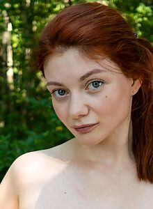 Horny redhead toying outdoors