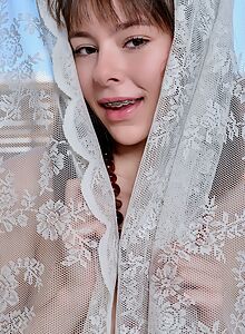 Cute brunette with braces takes off her dress