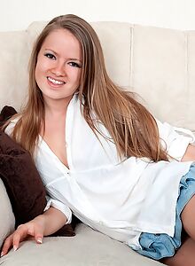 Cute shaved girl lifts up her skirt
