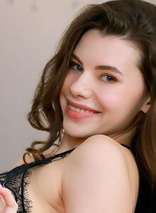 Cute shaved brunette in black lingerie