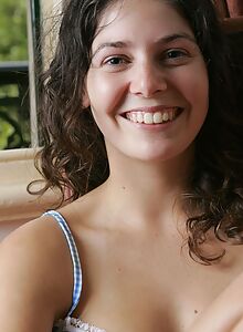 Cute brunette amateur reveals her hairy pussy