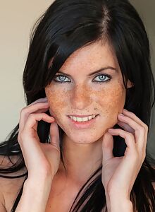 Freckled babe with black hair in lingerie