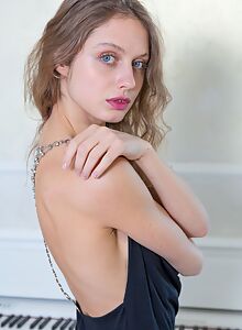 Skinny blonde with blue eyes shows off her small boobs