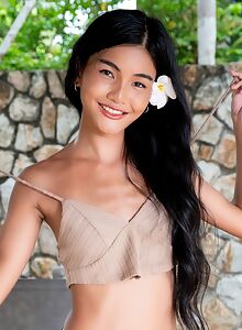 Asian cutie shows off her flawless shaved pussy