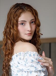 Cute shaved girl spreads her ass in bed