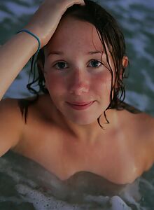 Freckled brunette amateur exposes her hairy bush at the beach