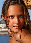 Tanned blonde girl nude in the sun