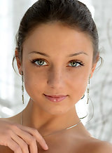 Adorable freckled brunette teen posing