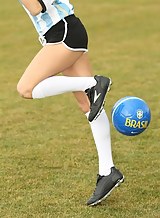 Black-haired soccer girl masturbating by the field