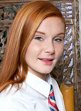 Freckled redhead schoolgirl stripping