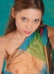 Gogeous petite teen cutie fooling around in a pool