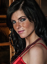 Freckled black-haired girl in lingerie