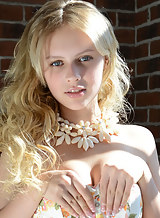 Gorgeous blue-eyed blonde teen posing nude