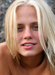 Perfect blonde teenies posing naked at the beach