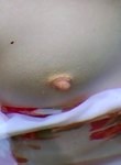 Brunette shows off her tiny hard nipples