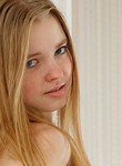 Strawberry blonde teen posing naked