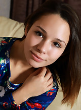 Cute brunette teen spreading on the couch