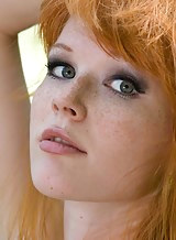 Stunning freckled redhead naked outdoors