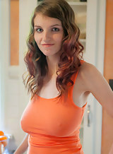 Redhead amateur with huge tits and areolas in a tank top