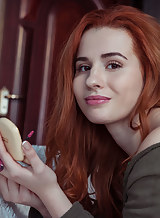 Sexy redhead teen posing nude
