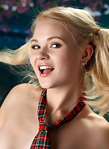 Gorgeous blonde schoolgirl Talia stripping