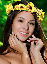 Cute brunette teen Emmy nude in a forest