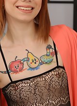 Tattooed redhead with small tits toying