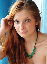 Blue-eyed redhead teen stripping