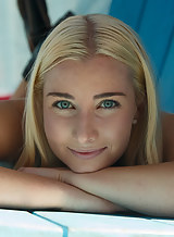 Upkisrt shots of a freckled blonde